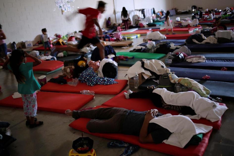 Asylum seekers rest at a migrant shelter run by the federal government in Ciudad Juarez, Mexico. 