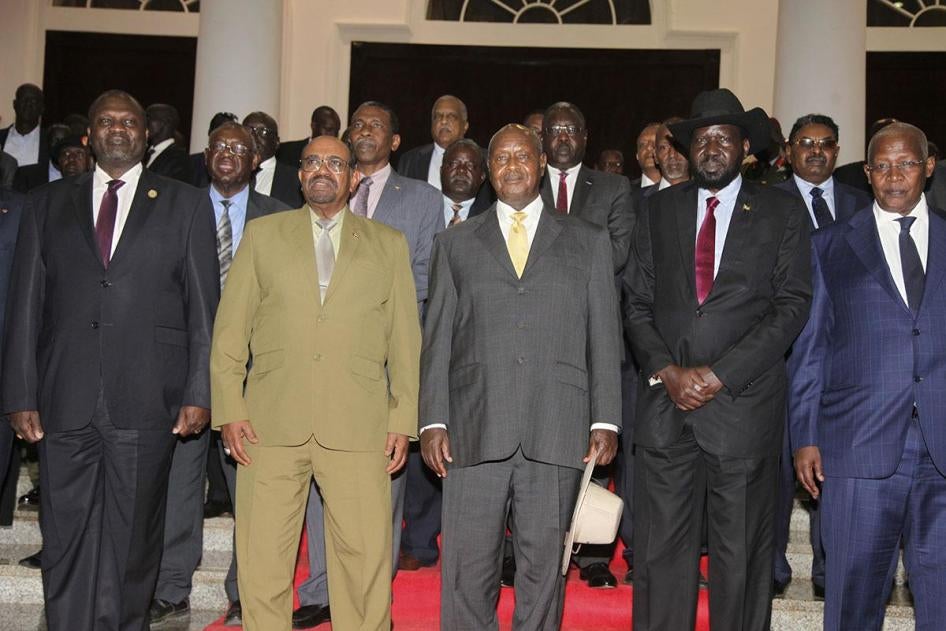Former Vice President of South Sudan Riek Machar, Sudan's President Omar al-Bashir, Uganda's President Yoweri Museveni, South Sudan's President Salva Kiir, and Uganda's Foreign Affairs Minister Sam Kutesa pose for a photograph as they meet at State House 