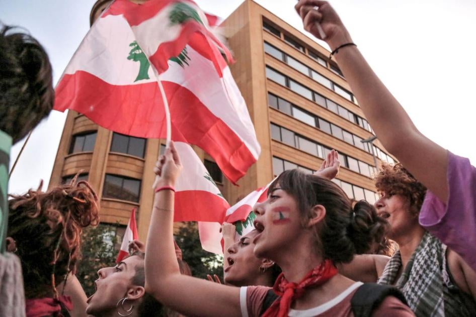 Women shout slogans and wave the Lebanese flag during a demonstration in down town Beirut.