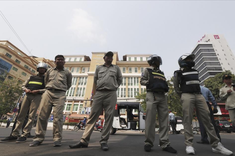 Cambodian police officers stand guard in front of the Phnom Penh Municipal Court during a hearing of Kem Sokha, the head of the dissolved Cambodia National Rescue Party, in Phnom Penh, Cambodia, Thursday, Jan. 16, 2020. The trial of the top Cambodian oppo