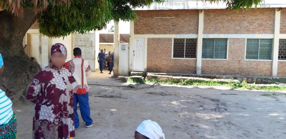 Police guard a makeshift quarantine site in a government building in Kanyenkoko neighborhood in Rumonge, Burundi, preventing people from leaving on March 30, 2020. Over a hundred people are currently held in the site in unsanitary conditions.
