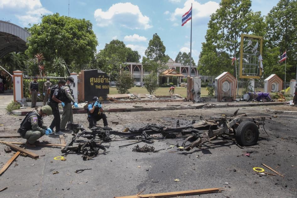 Thai crime scene investigators inspect the site of a bomb explosion in Yala, southern Thailand, Tuesday, March 17, 2020.