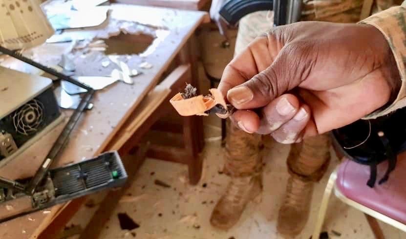 A man holds an IED fragment