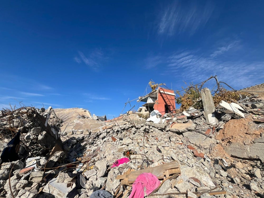 The remnants of a destroyed a two-story building after an Israeli strike on November 1, 2024, in the al-Salah neighborhood in Younine, Lebanon. 