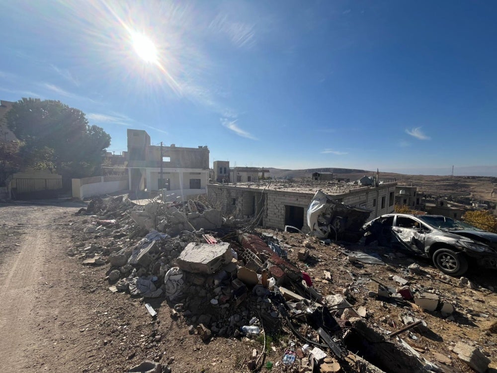 The damage caused to nearby houses and vehicles after an Israeli  airstrike on a two-story building on November 1, 2024, in the al-Salah neighborhood in Younine, Lebanon.