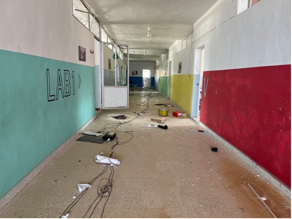 Damaged school equipment strewn across the hallway floor at Naqqoura Intermediate Public School, Lebanon, January 31, 2025. 