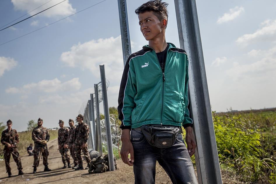 A 16-year-old boy from Afghanistan who said he had waited for more than 6 hours to be reunited with his family in Roszke, Hungary, at the border with Serbia, after they became separated. September 13, 2015.