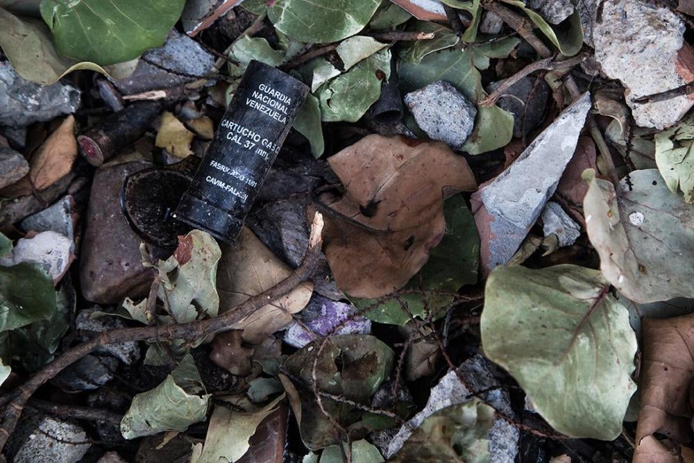 A tear gas canister lies on the ground at a place where clashes between the Bolivarian National Guard and anti-government demonstrators had taken place in Caracas.