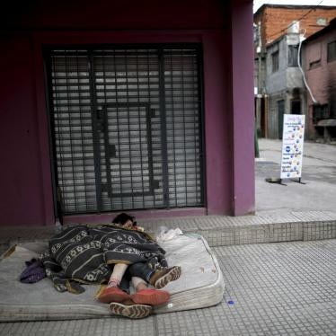 Homeless women sleep outside on a mattress in the "Villa 31" neighborhood during a government-ordered lockdown to curb the spread of the new coronavirus in Buenos Aires, Argentina, Wednesday, May 6, 2020. 