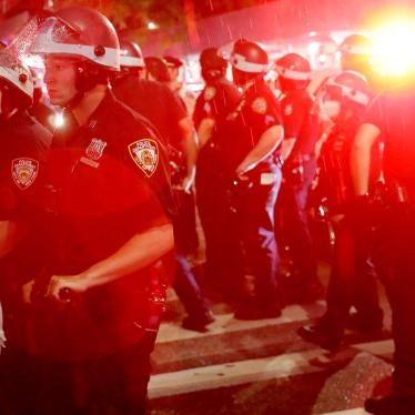Police stand by as other officers arrest protesters in New York, Wednesday, June 3, 2020.
