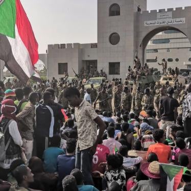 Sudanese soldiers stand guard as demonstrators rally near the army headquarters in the Sudanese capital Khartoum, April 11, 2019.