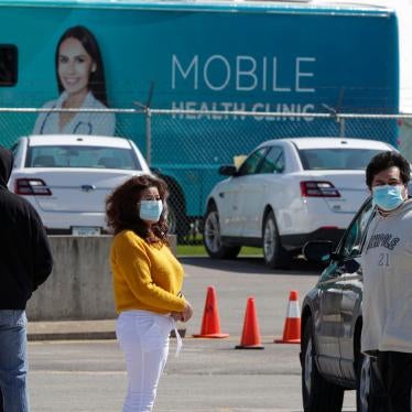 Workers line up to enter the Tyson Foods port processing plant in Logansport, Indiana, May 7, 2020.