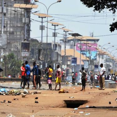 A group of people standing in a city street
