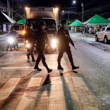 Filipino army troopers patrol a street in the Philippines in the early morning, March 15, 2020. 