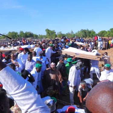People attend a funeral for people killed by suspected Boko Haram in Zaabarmar, Borno, Nigeria, November 29, 2020. 