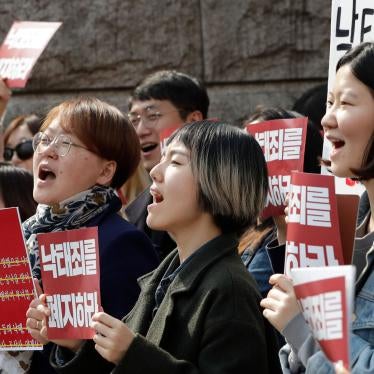 Protesters celebrate after listening to a judgment during a rally demanding the abolition of abortion law outside of the Constitutional Court in Seoul, South Korea, April 11, 2019.