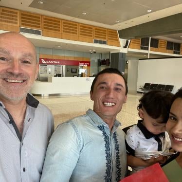 Sadam Abudusalamu's lawyer Michael Bradley, Sadam Abudusalamu, his son Lutfy and wife Nadila.