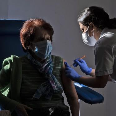 A medical staff member administers a dose of the Pfizer-Biotech vaccine to a person over eighty years old, in the Santa Maria della Pieta hospital in Rome, Italy.