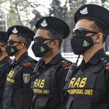 Bangladeshi RAB (Rapid Action Battalion) Dog squad unit stand on guard at the Central Shaheed Minar in Dhaka, Bangladesh. 