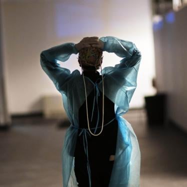 Registered traveling nurse Patricia Carrete walks down a hallway during a night shift at a field hospital set up to handle a surge of COVID-19 patients, Wednesday, Feb. 10, 2021, in Cranston, Rhode Island, US.