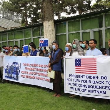 Former Afghan interpreters hold placards during a protest against the U.S. government and NATO in Kabul, Afghanistan on April 30, 2021.