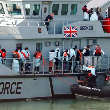 A group of people on the deck of HMC Seeker as they wait to be brought ashore by the UK Border Force in Kent. September 22, 2020.