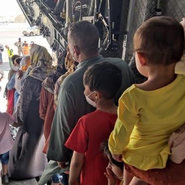 People inside an aircraft line up to disembark 