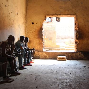 Rwandans sit in the Gikondo transit center in Kigali on September 24, 2015.