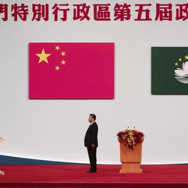 Macao Chief Executive Ho Iat Seng, left, reads his oath of office in front of Chinese leader Xi Jinping at the inauguration ceremony in Macao, December 20, 2019.
