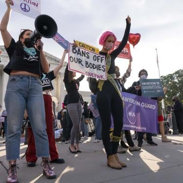 Women holding protest signs