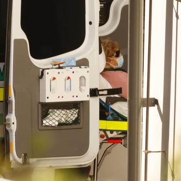 A woman in the back of an ambulance