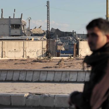 Fighters with the Kurdish-led Syrian Democratic Forces deploy around al-Sina’a prison in the Ghweran district of al-Hasakah, northeast Syria, on January 25, 2022, midway through the 10-day battle to recapture it from the Islamic State (ISIS). © 2022 AFP Photo via Getty Images