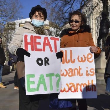 Protesters hold placards during a rally urging the government to help people with their energy bills, London, United Kingdom, January 31, 2022.