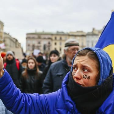 A protester holds up a phone during a demonstration
