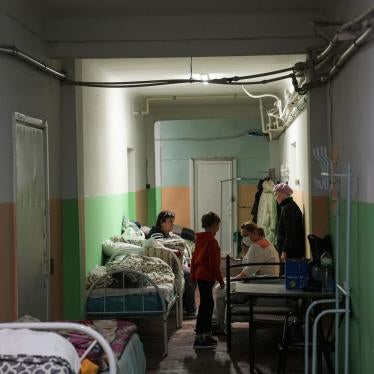 Women and their children sit in the basement of a maternity hospital converted into a medical ward and used as a bomb shelter in Mariupol, Ukraine