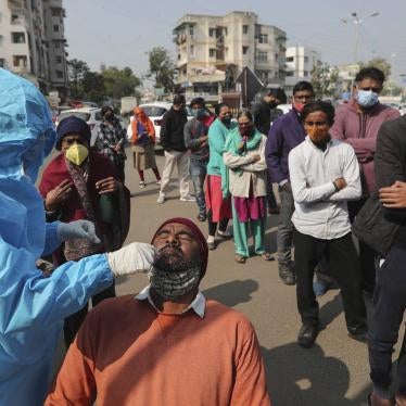 A health worker takes a swab sample of a man to test for Covid-19 in Ahmedabad, India, January 17, 2022.
