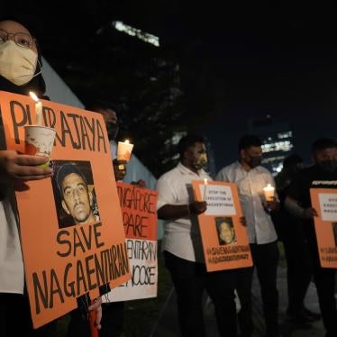 Activists holds posters against the impending execution of Nagaenthran K. Dharmalingam