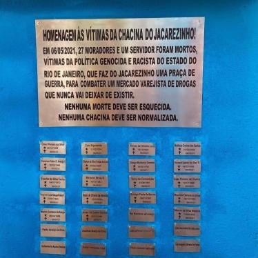 The memorial in the Jacarezinho neighborhood in Rio de Janeiro, Brazil showing an inscription and names of those killed on metal plates