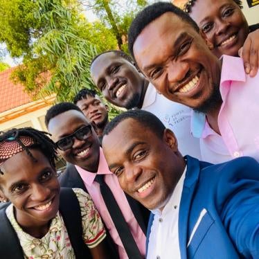 Frank Mugisha, the director of Sexual Minorities Uganda, (center) with members of Uganda's LGBTQ community in Kampala.