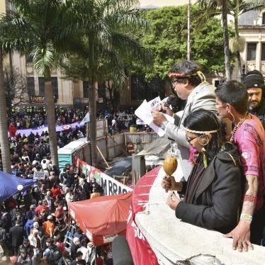 Indigenous leaders read a manifesto to a large crowd at a law school