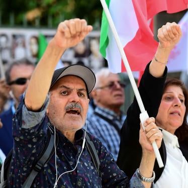 People react to the verdict of Hamid Noury, a former Iranian official sentenced to life in prison, outside the Stockholm District Court, Sweden on July 14, 2022.
