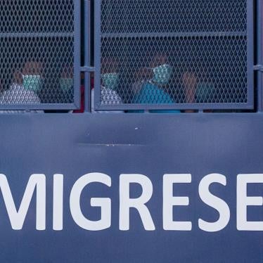 An immigration vehicle takes Myanmar nationals to a Malaysian naval base for deportation, February 23, 2021.