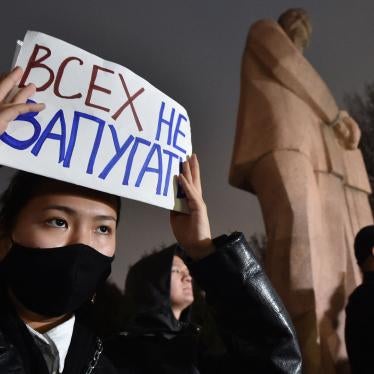 A protester holds a sign saying “don’t scare everyone” during a rally for freedom of speech and freedom for political prisoners in Bishkek, Kyrgyzstan on November 25, 2022. 