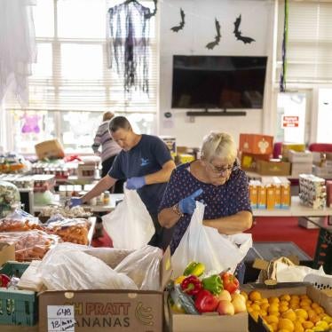 Volunteers sort food into food parcels at the Rumney Forum community charity on November 8, 2022 in Cardiff, Wales. 