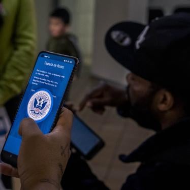 A person uses an app on their cell phone