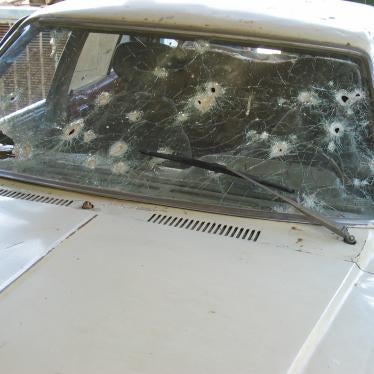A car shot-up by US soldiers during the protest on April 28, 2003. The US military claimed that gunmen were using the car as cover, but protesters denied that any of them had opened fire.