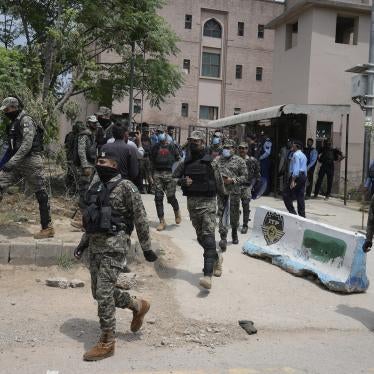 Paramilitary troops and police officers stand guard outside a court where Pakistan's former Prime Minister Imran Khan is scheduled to appear in Islamabad, Pakistan, May 23, 2023. 