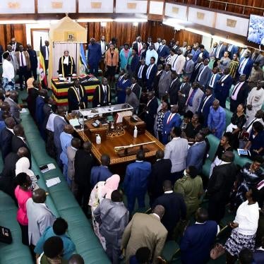 Ugandan Members of Parliament stand as they participate during the passing of the anti-Homosexuality bill, at a sitting inside the Parliament Buildings in Kampala, Uganda, May 2, 2023.