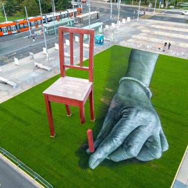 A land art painting called "All of us!" by the artist Saype in front of the United Nations headquarters in Geneva installed during a meeting of the Convention on Cluster Munitions, September 11, 2023. 