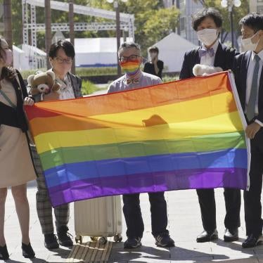 Gen Suzuki, center, enters Shizuoka family court in Hamamatsu, Shizuoka prefecture, central Japan for a court hearing on October 14, 2022.
